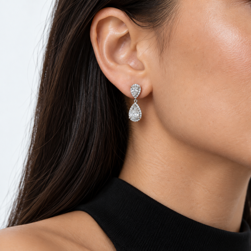 Twin Pear Halo Lab Diamond Drop Earrings worn on the ear, shown true to size
