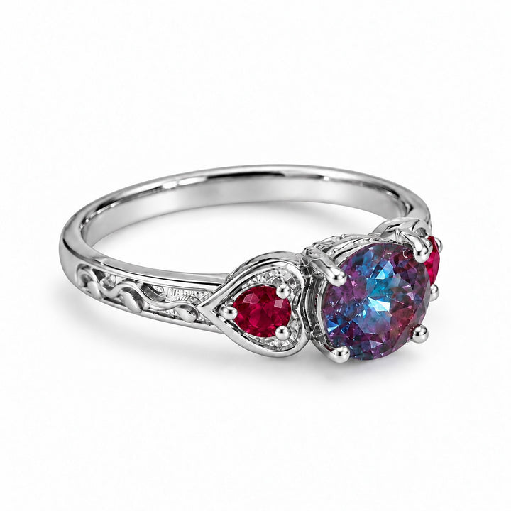 The Roserie — Alexandrite & Ruby Three-Stone Ring in platinum, angled view