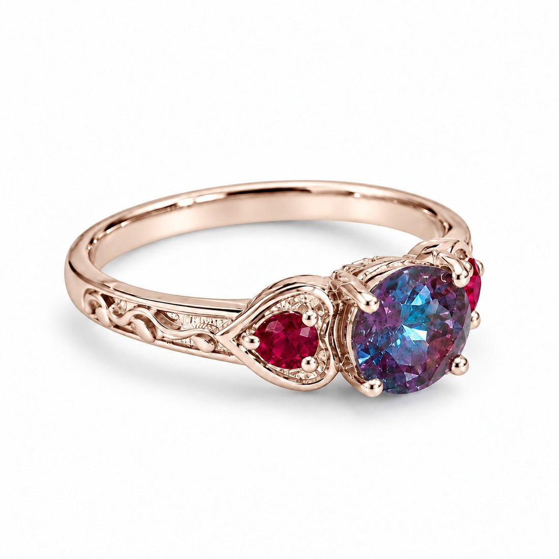 The Roserie — Alexandrite & Ruby Three-Stone Ring in 14K rose gold, angled view
