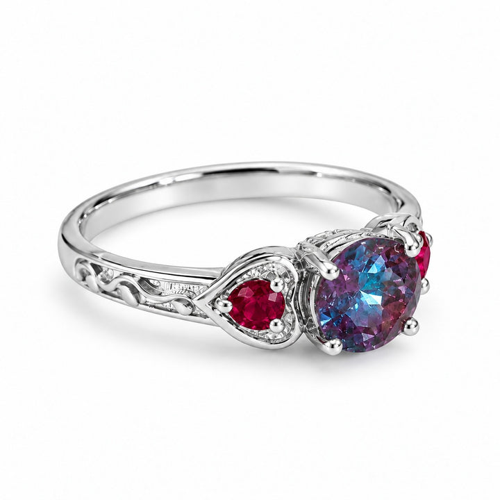 The Roserie — Alexandrite & Ruby Three-Stone Ring in 14K white gold, angled view