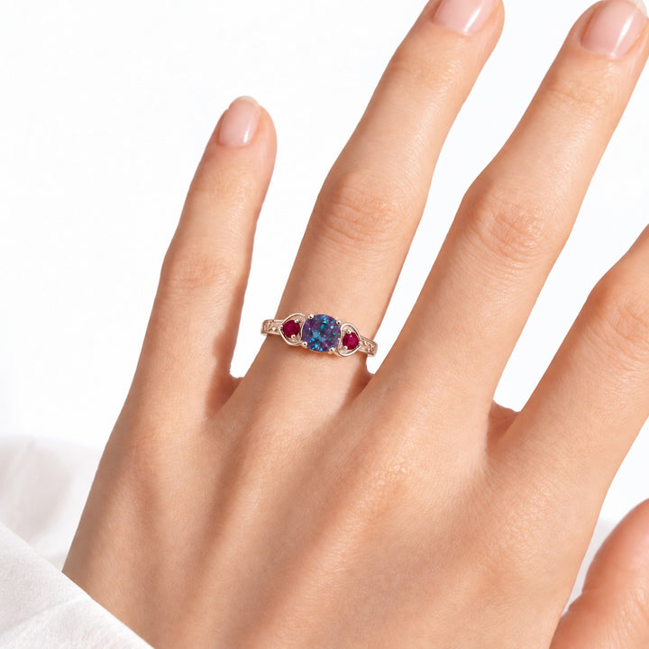 The Roserie — Alexandrite & Ruby Three-Stone Ring in 14K rose gold, worn on hand
