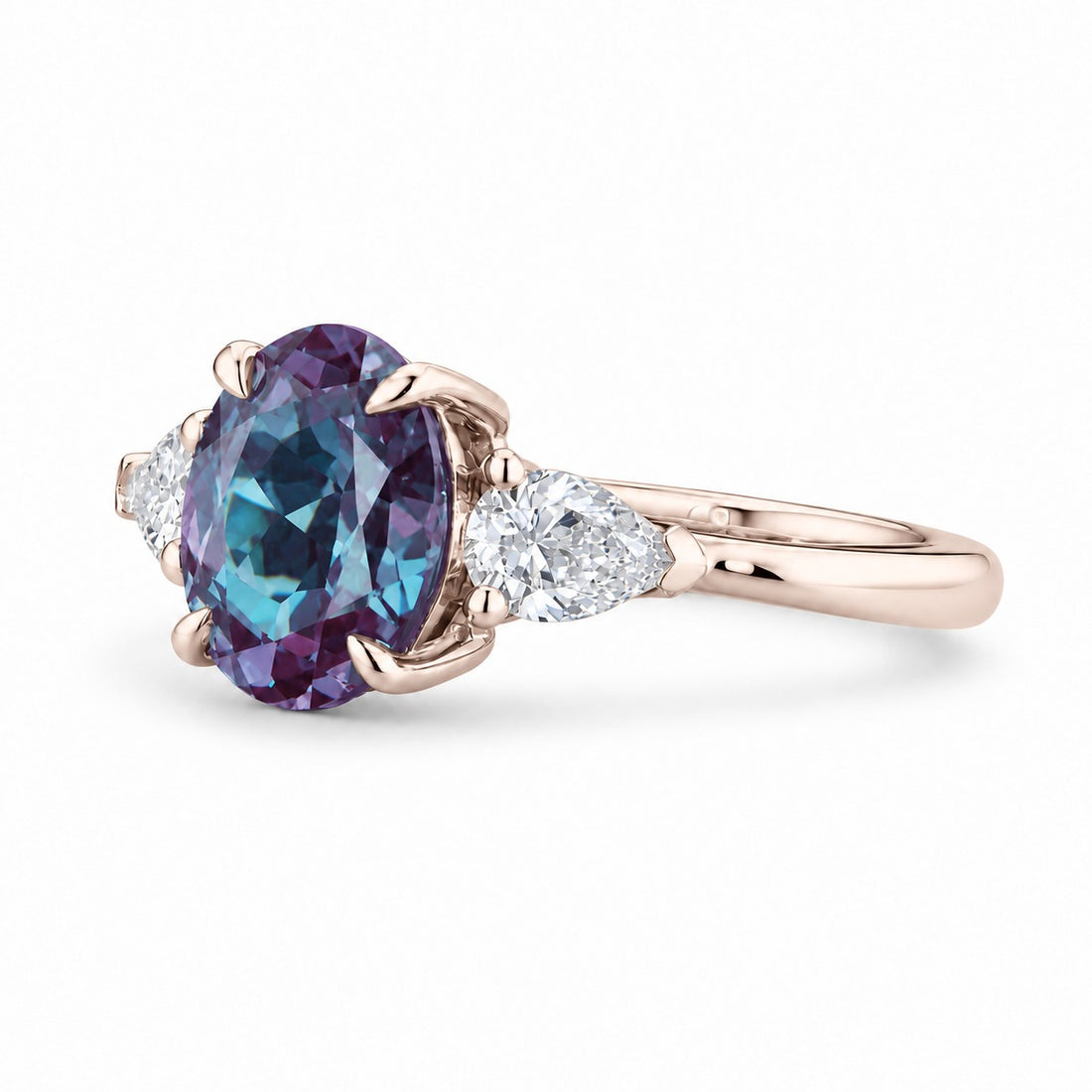 The Virelle — Oval Alexandrite Three-Stone Ring in 14K rose gold, angled view