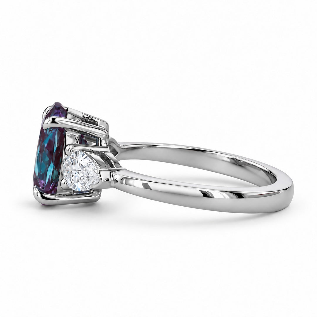 The Virelle — Oval Alexandrite Three-Stone Ring in platinum, side view