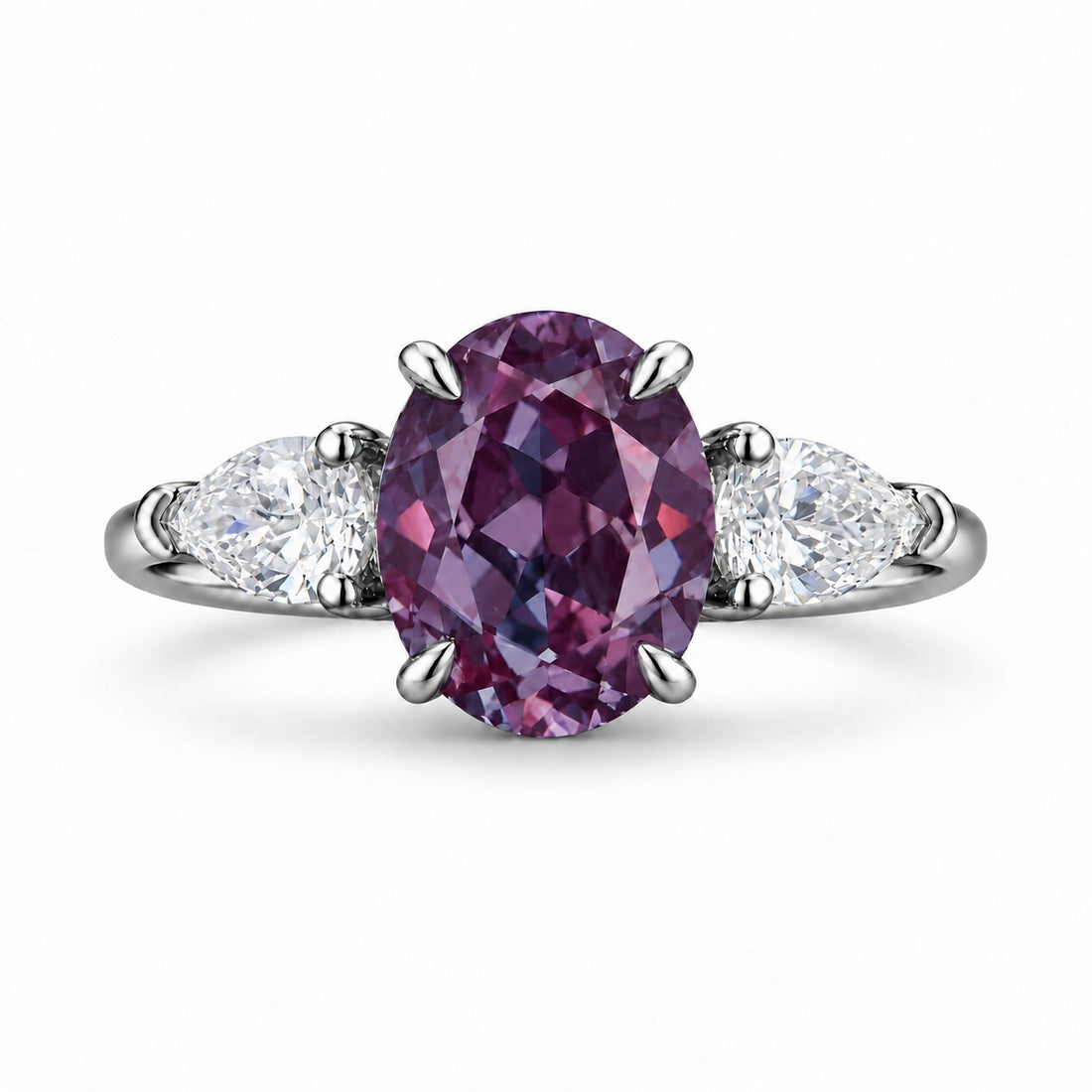 The Virelle — Oval Alexandrite Three-Stone Ring in platinum, in warm light