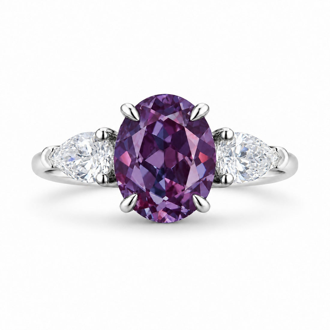 The Virelle — Oval Alexandrite Three-Stone Ring in 14K white gold, in warm light