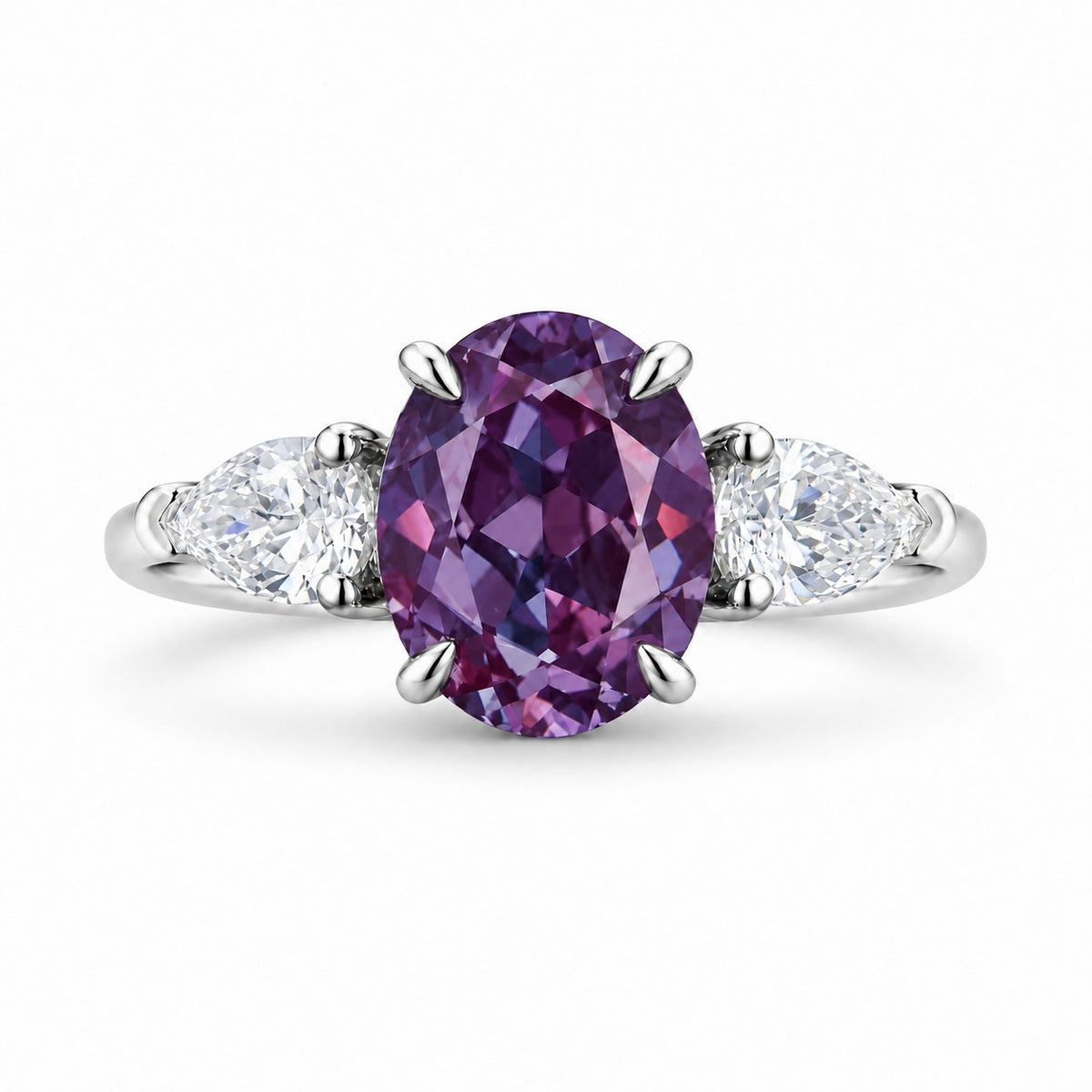The Virelle — Oval Alexandrite Three-Stone Ring in 14K white gold, in warm light