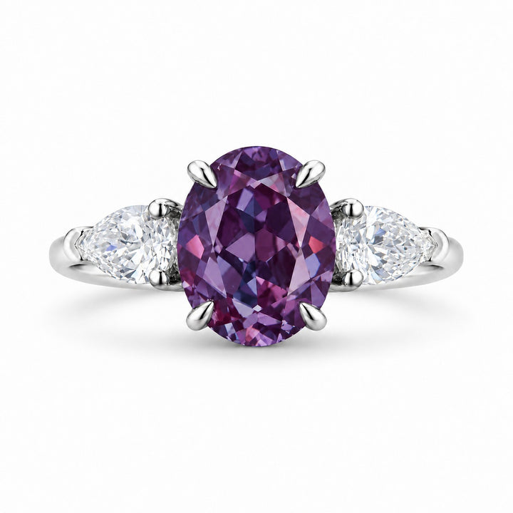 The Virelle — Oval Alexandrite Three-Stone Ring in 14K white gold, in warm light