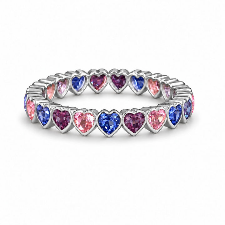 Heart Sapphire & Alexandrite Eternity Band in platinum, in warm light