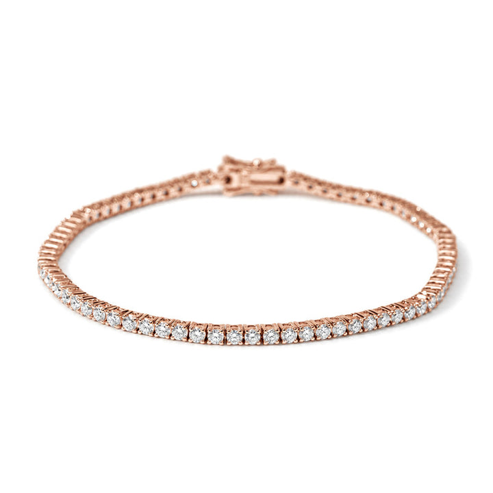 Classic round lab diamond tennis bracelet in 14K rose gold, close-up detail of the settings