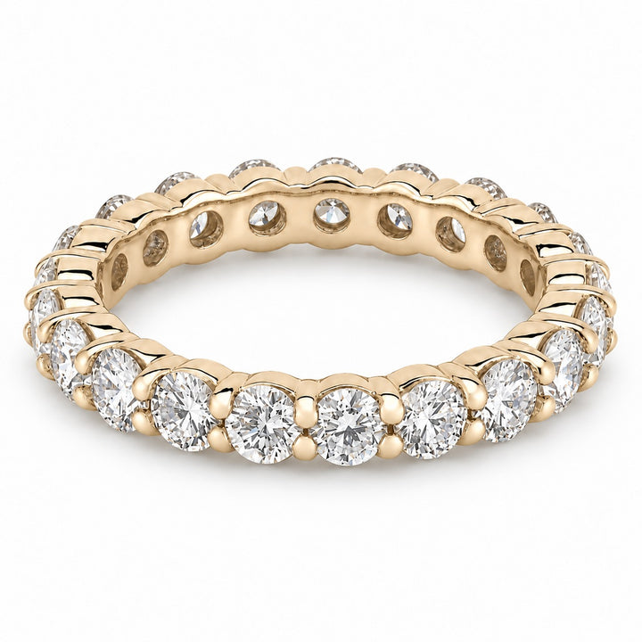 Classic round lab-grown diamond eternity band, 3.0mm, 14K yellow gold, angled view