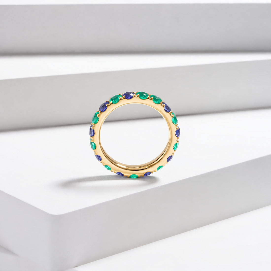Colombian Emerald & Blue Sapphire Alternating Eternity Band in 14K yellow gold, lifestyle