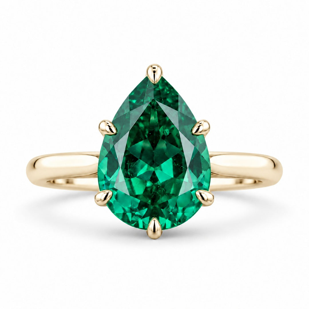 The Lotus Lace — Pear Emerald Ring (Petal Setting) in 14K yellow gold, front view