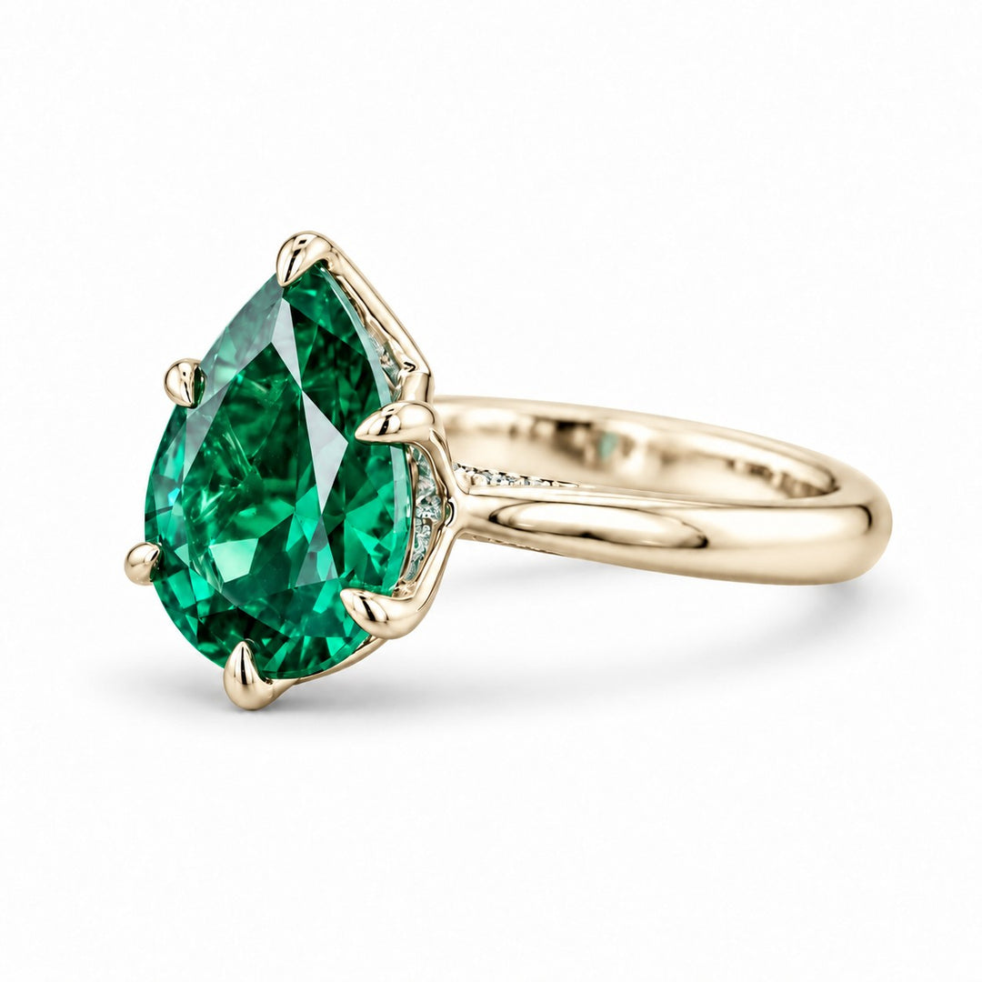 The Lotus Lace — Pear Emerald Ring (Petal Setting) in 14K yellow gold, side view