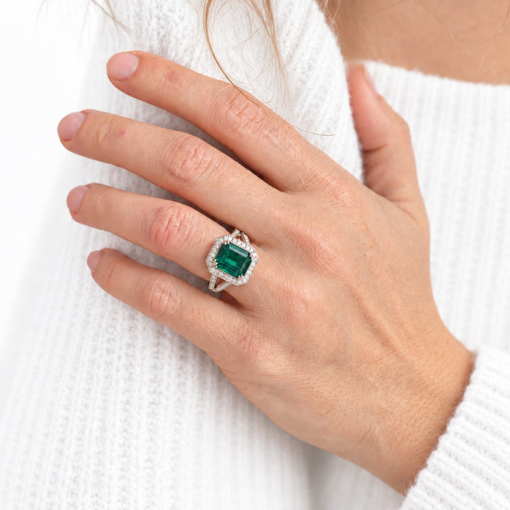 The Interlace — Split Pavé Emerald Halo in 14K rose gold, on the hand