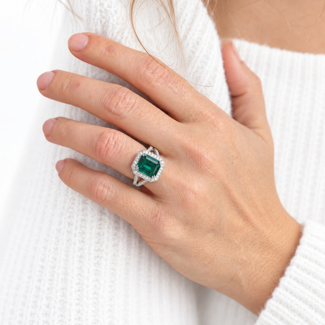 The Interlace — Split Pavé Emerald Halo in 14K white gold, on the hand