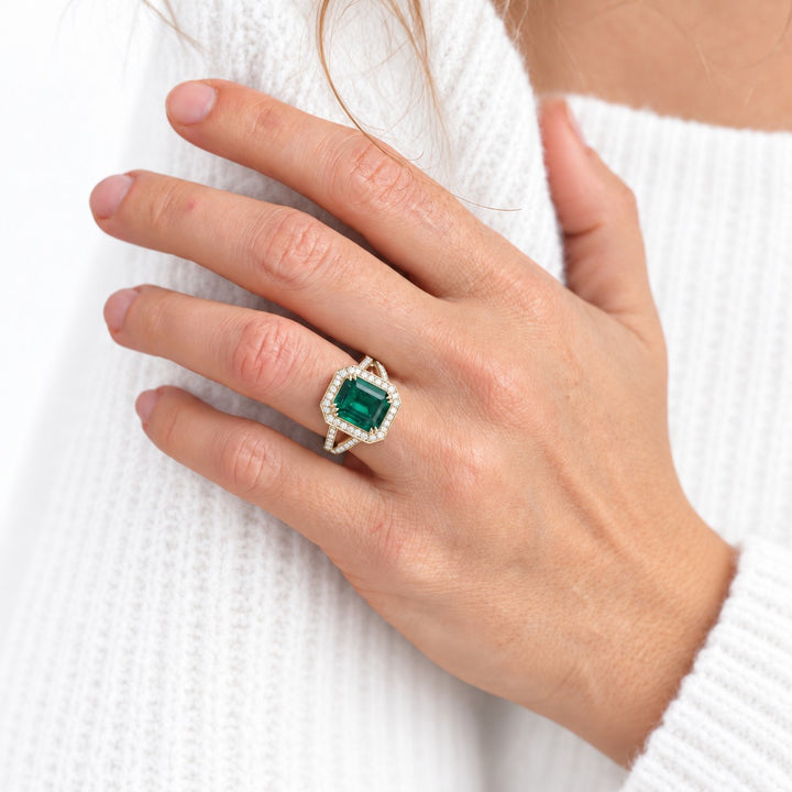 The Interlace — Split Pavé Emerald Halo in 14K yellow gold, on the hand