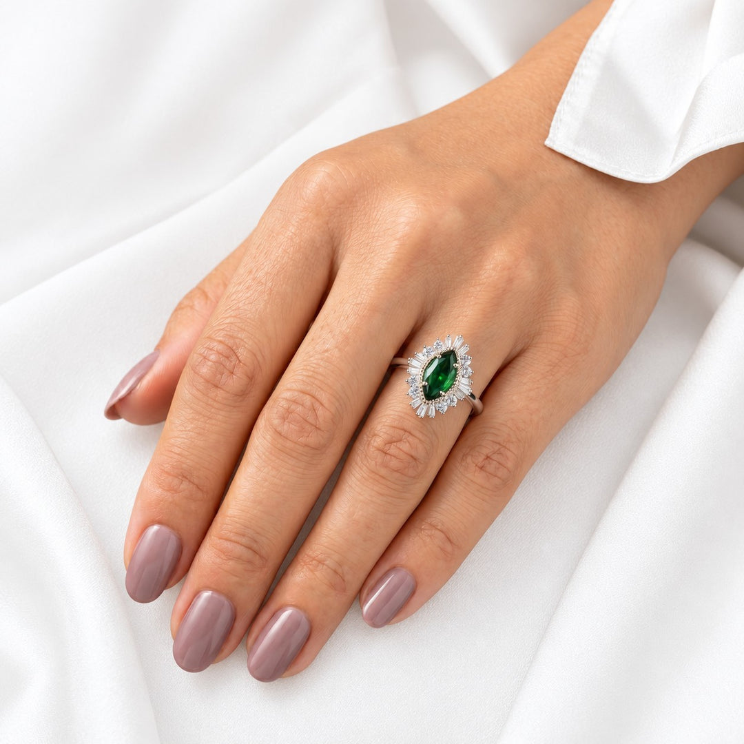 The Helios — Diamond Sunburst Emerald Ring in 14K white gold, on the hand