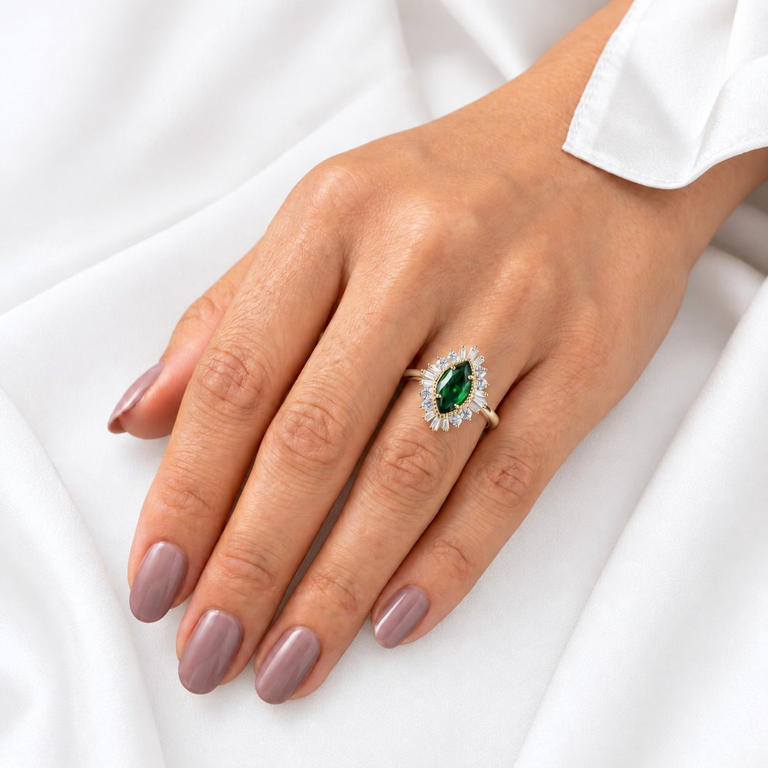 The Helios — Diamond Sunburst Emerald Ring in 14K yellow gold, on the hand