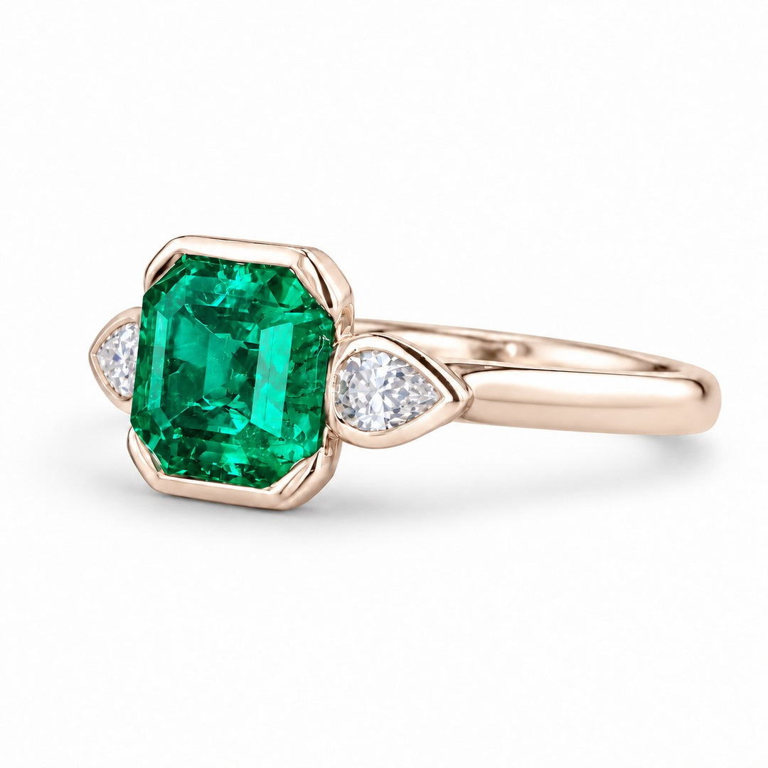 The Embrace — Emerald & Diamond Ring in 14K rose gold, three-quarter view