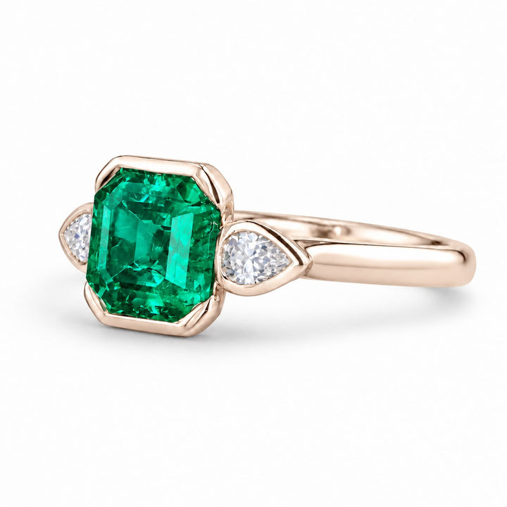 The Embrace — Emerald & Diamond Ring in 14K rose gold, three-quarter view