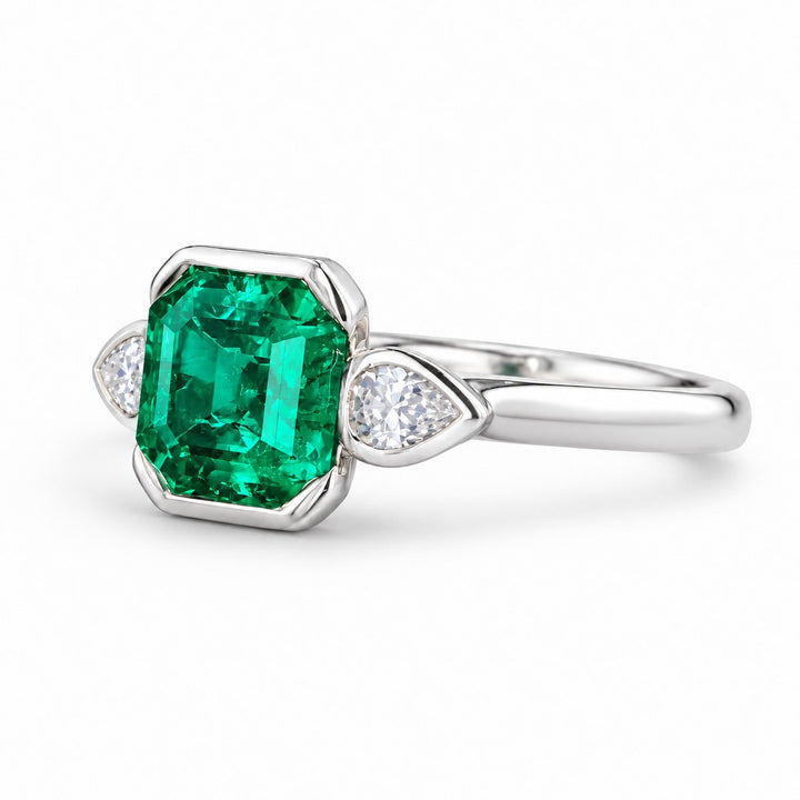 The Embrace — Emerald & Diamond Ring in 14K white gold, three-quarter view