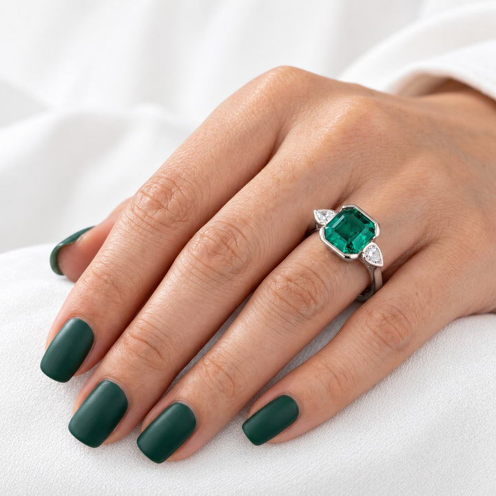 The Embrace — Emerald & Diamond Ring in 14K white gold, on the hand