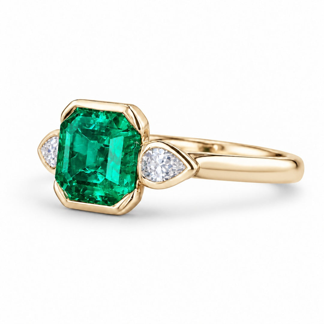 The Embrace — Emerald & Diamond Ring in 14K yellow gold, three-quarter view