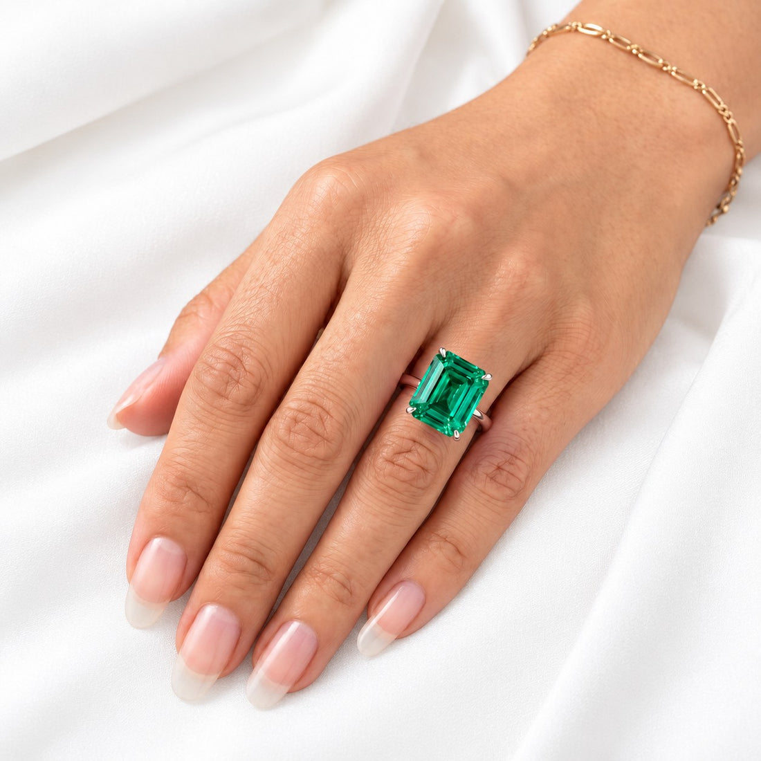 The Prime — Emerald Ring in 14K white gold, on the hand