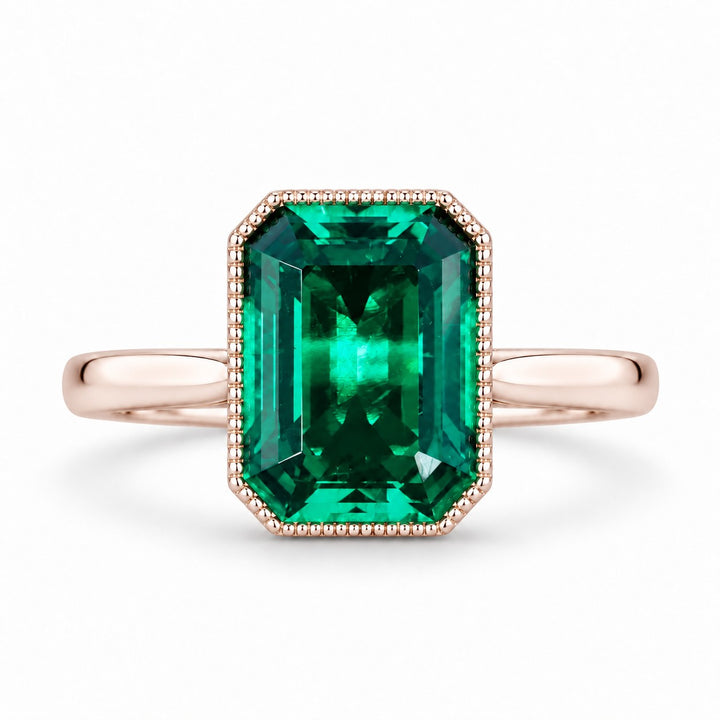 The Paragon — Milgrain Bezel Emerald Ring in 14K rose gold, front view