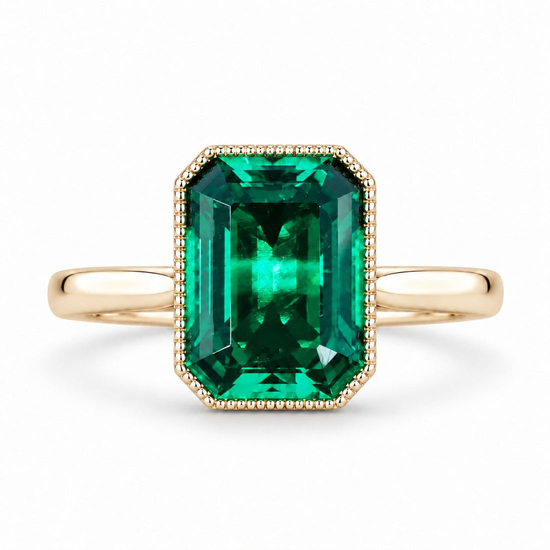 The Paragon — Milgrain Bezel Emerald Ring in 14K yellow gold, front view
