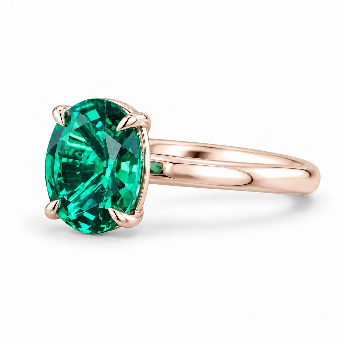 The Essence — Oval Emerald Ring in 14K rose gold, three-quarter view