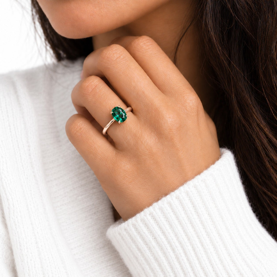 The Essence — Oval Emerald Ring in 14K rose gold, on the hand