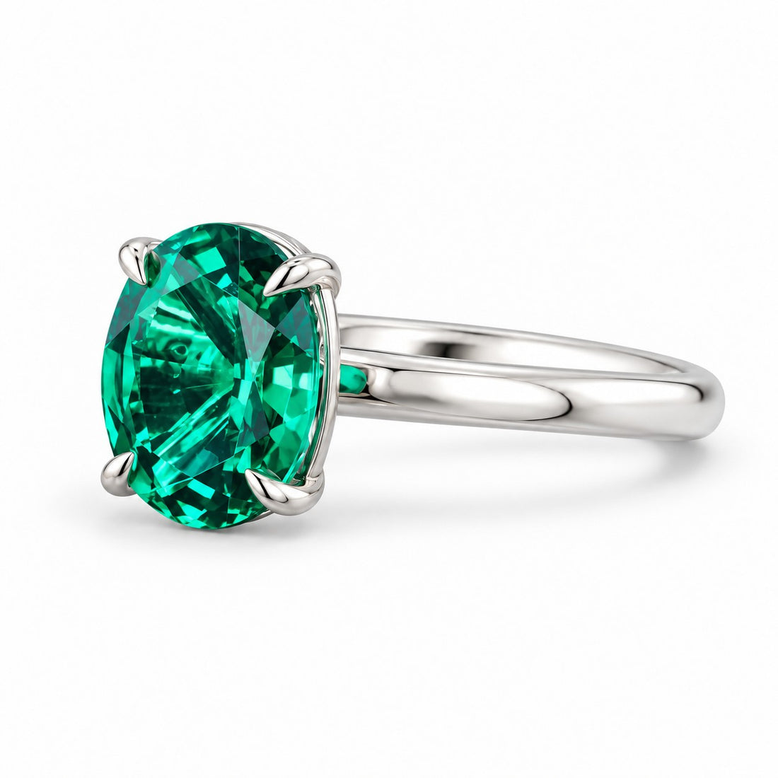 The Essence — Oval Emerald Ring in 14K white gold, three-quarter view