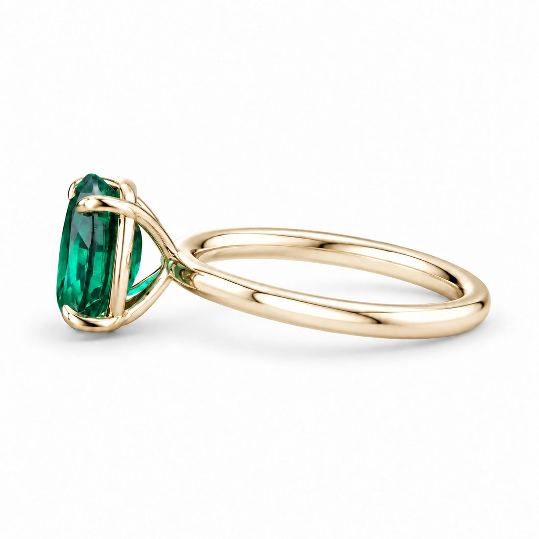 The Essence — Oval Emerald Ring in 14K yellow gold, side view