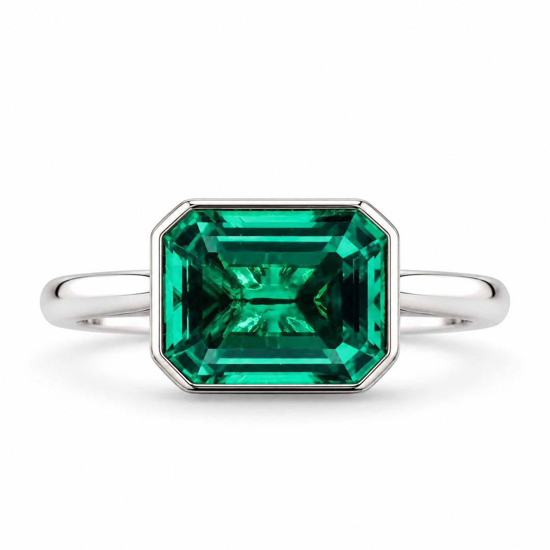 The Axis — East–West Emerald Ring in 14K white gold, front view