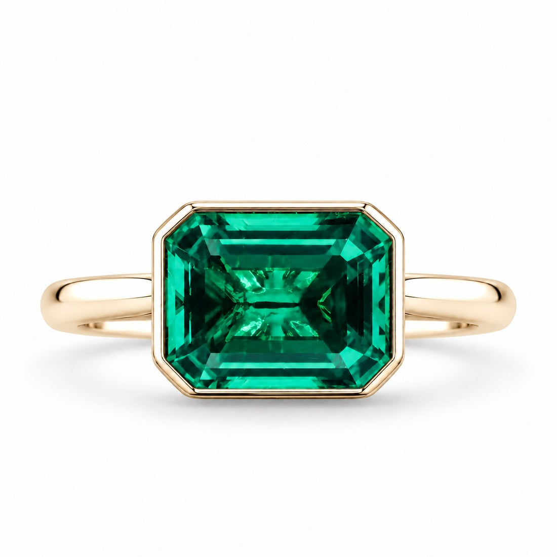The Axis — East–West Emerald Ring in 14K yellow gold, front view