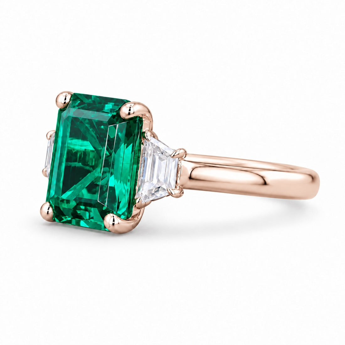 The Meridian — Emerald Three-Stone Ring in 14K rose gold, side view