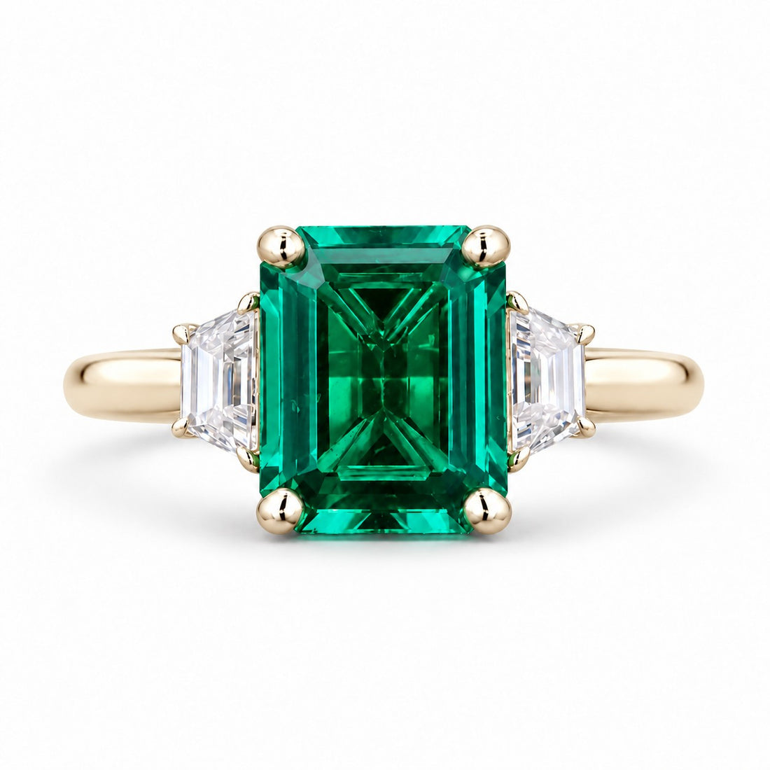 The Meridian — Emerald Three-Stone Ring in 14K yellow gold, front view