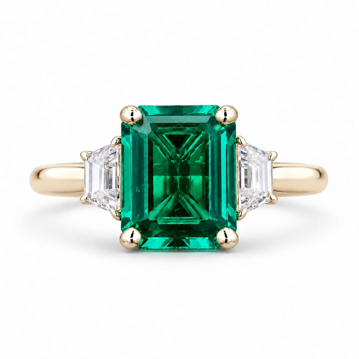 The Meridian — Emerald Three-Stone Ring in 14K yellow gold, front view