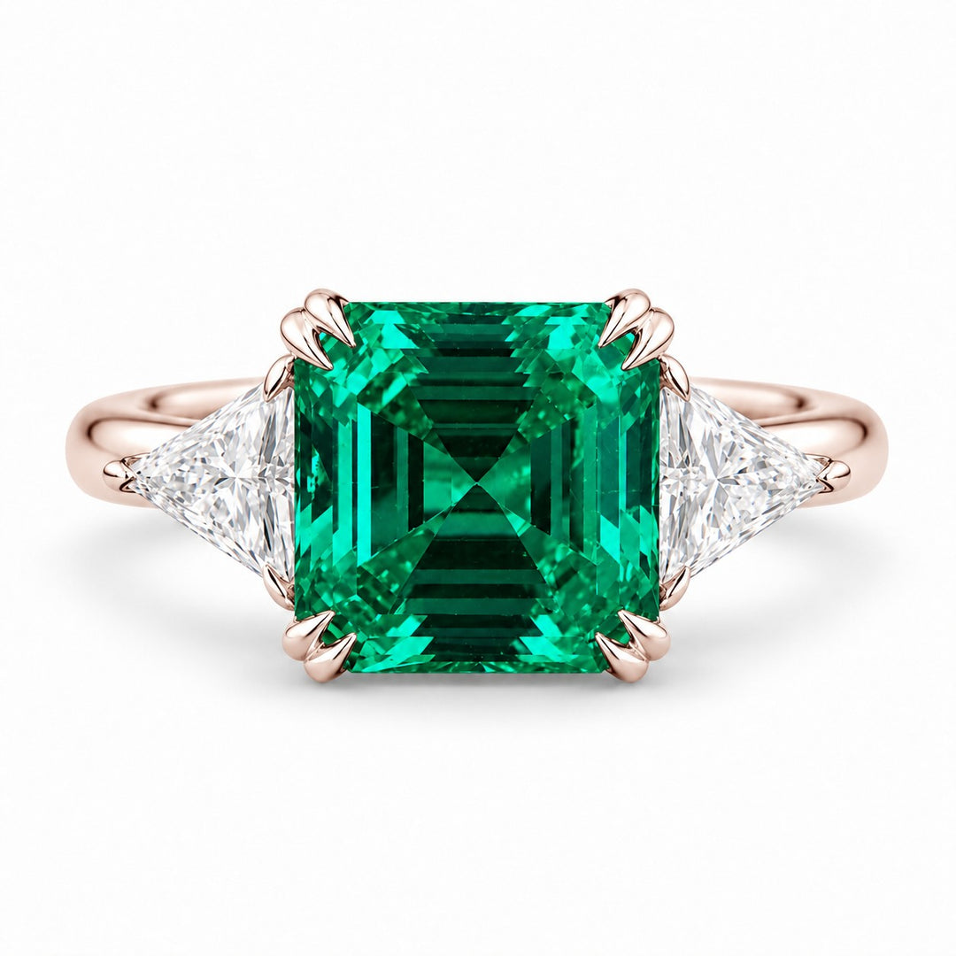 The Facet — Emerald Three-Stone Ring in 14K rose gold, front view