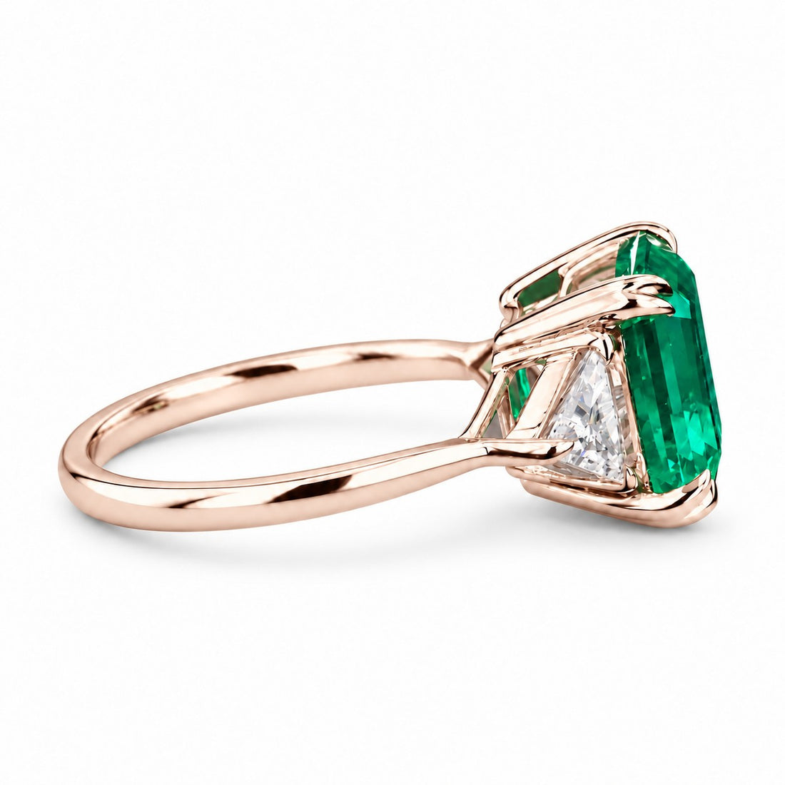 The Facet — Emerald Three-Stone Ring in 14K rose gold, side view