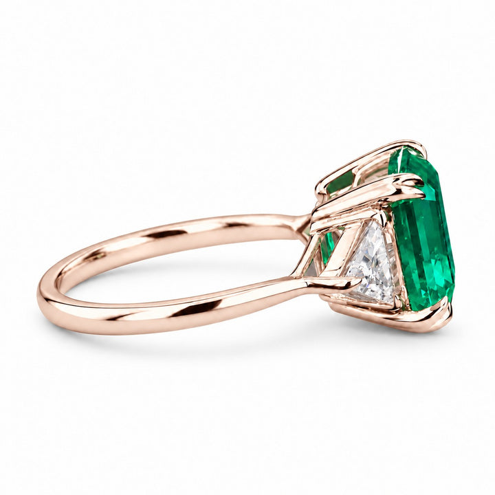 The Facet — Emerald Three-Stone Ring in 14K rose gold, side view
