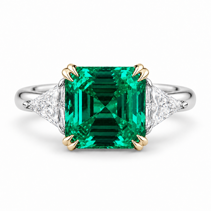 The Facet — Emerald Three-Stone Ring in 14K two-tone gold, front view