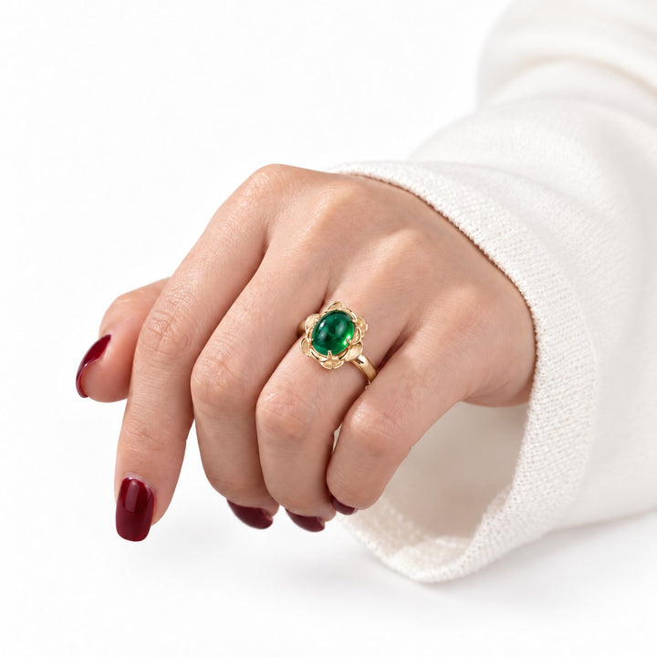 The Bloom — Cabochon Emerald Ring in 14K yellow gold, on the hand