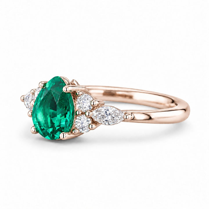 The Dew — Pear Emerald Ring in 14K rose gold, three-quarter view