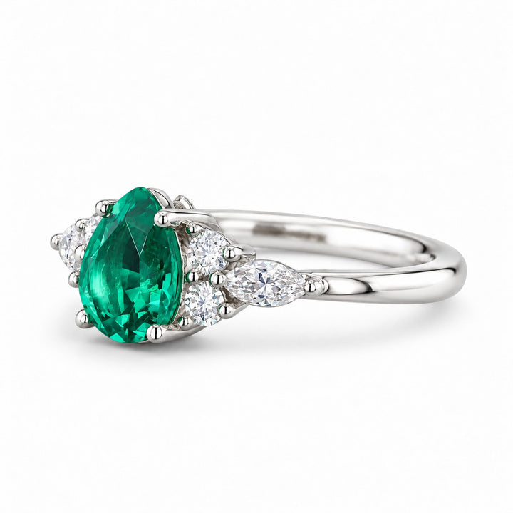The Dew — Pear Emerald Ring in 14K white gold, three-quarter view