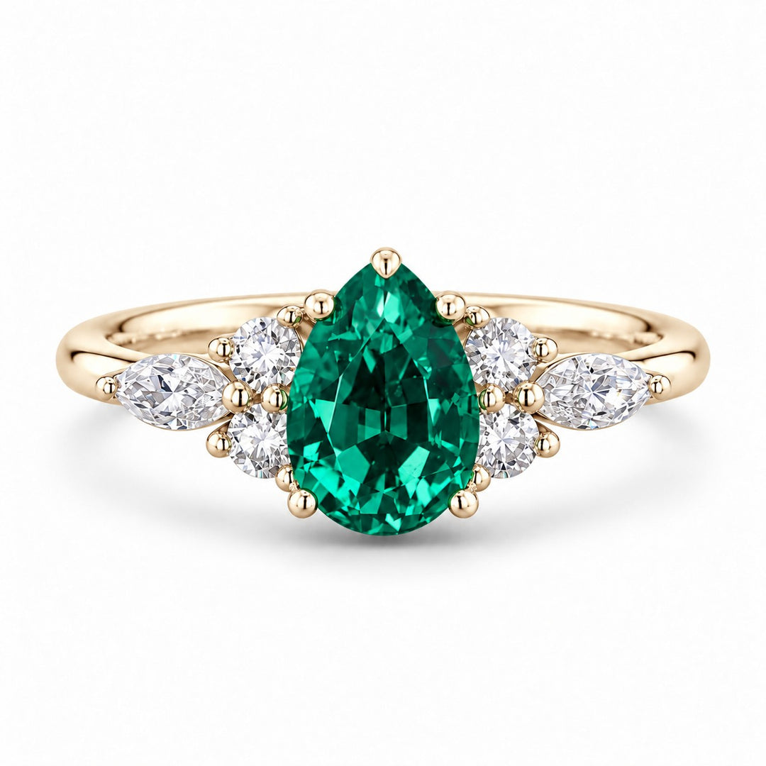 The Dew — Pear Emerald Ring in 14K yellow gold, front view