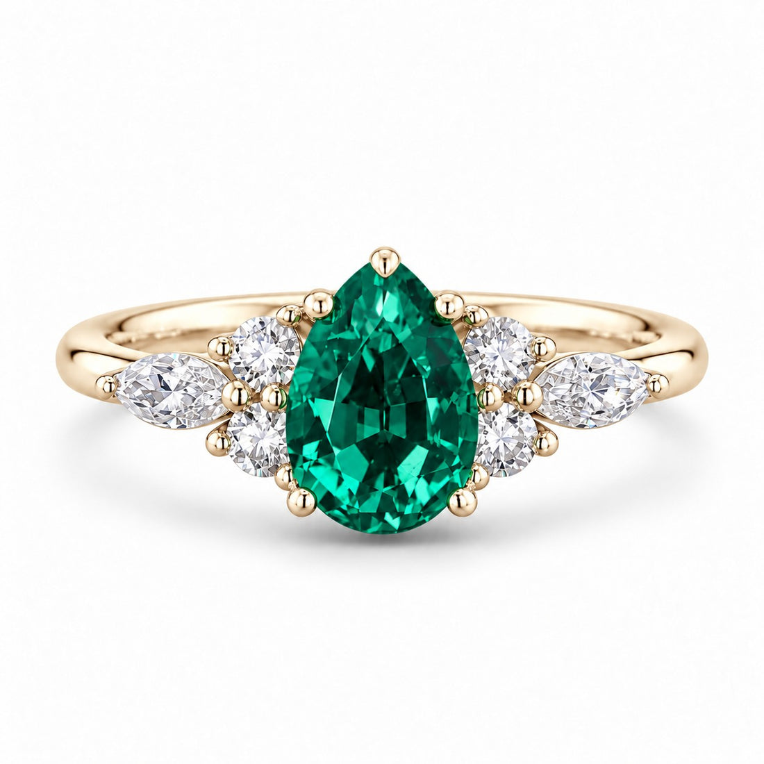 The Dew — Pear Emerald Ring in 14K yellow gold, front view