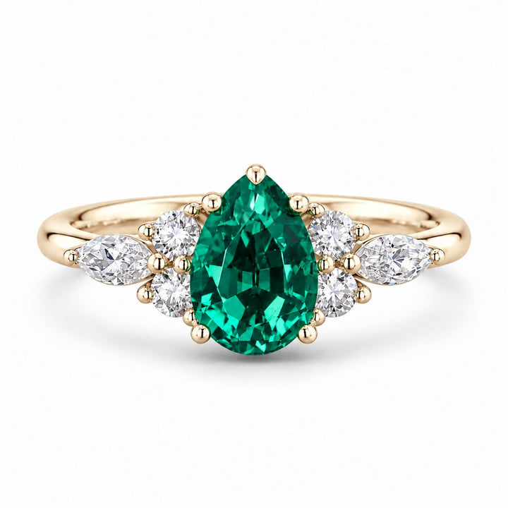 The Dew — Pear Emerald Ring in 14K yellow gold, front view