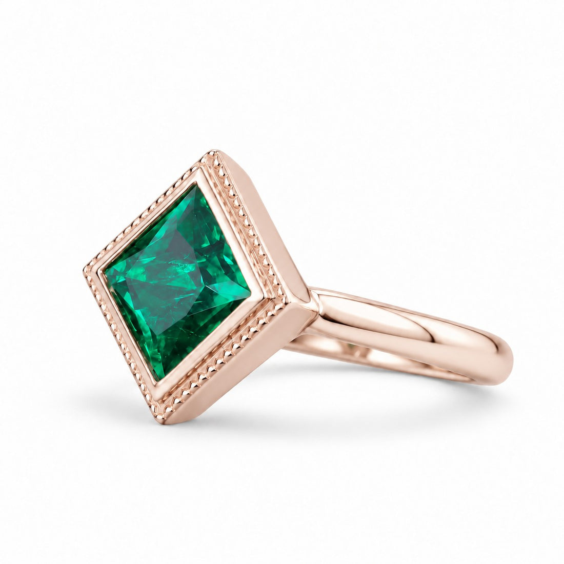 The Compass — Milgrain Bezel Emerald Ring in 14K rose gold, three-quarter view